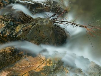 Close-up of water flowing through rocks