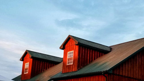 Low angle view of red house against sky