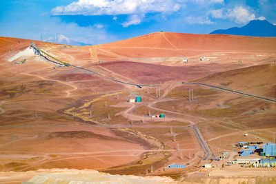 Aerial view of a long conveyor belt at copper mine in the altiplano of the atacama desert, chile.