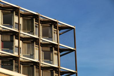 Low angle view of building against clear blue sky