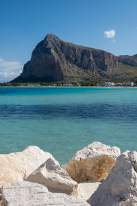 Scenic view of sea and rocks against sky