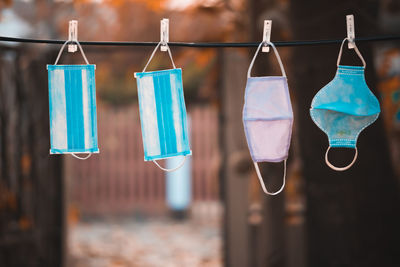 Close-up of clothes hanging on clothesline