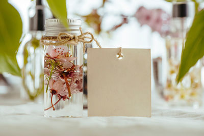 Close-up of flowers in jar on table