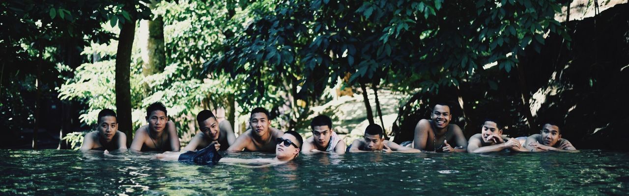 PEOPLE ENJOYING IN SWIMMING POOL