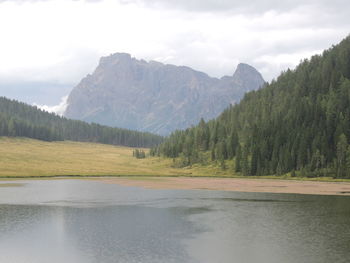 Scenic view of lake and mountains against sky