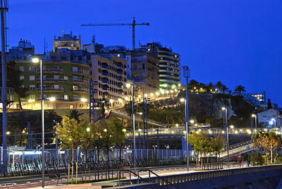 Illuminated buildings in city at night