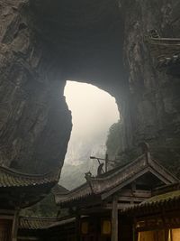 Buildings seen through arch of house