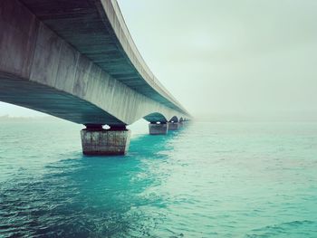 View of bridge over sea against sky