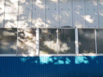 Full frame shot of swimming pool against building