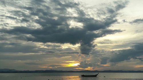 Scenic view of sea against dramatic sky