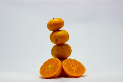Close-up of oranges against orange background