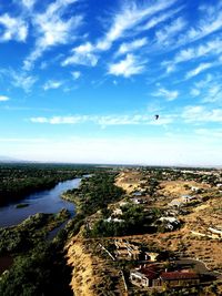 Aerial view of sea against cloudy sky
