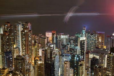 Aerial view of city lit up at night