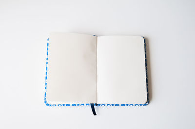 Close-up of open book against white background