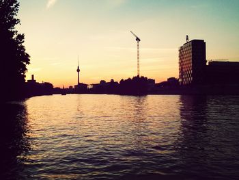 Scenic view of river at sunset