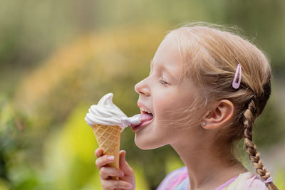 Close-up of young woman drinking water