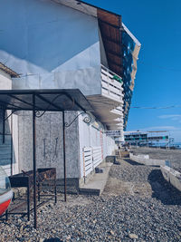 Low angle view of buildings against clear blue sky