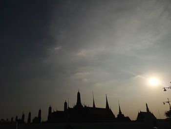 Silhouette of city at sunset