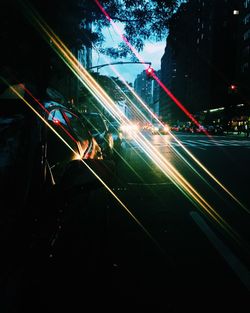 Light trails on road in city at night