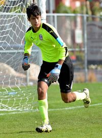 Full length of man playing soccer ball