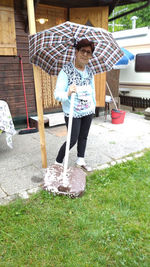 Full length of man standing in yard