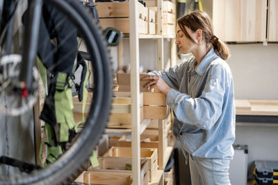 Side view of a woman with bicycle