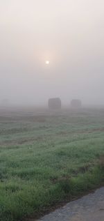 Scenic view of field against sky during sunset