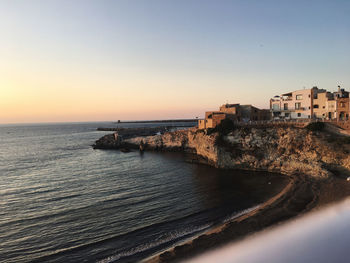 Scenic view of sea against clear sky during sunset