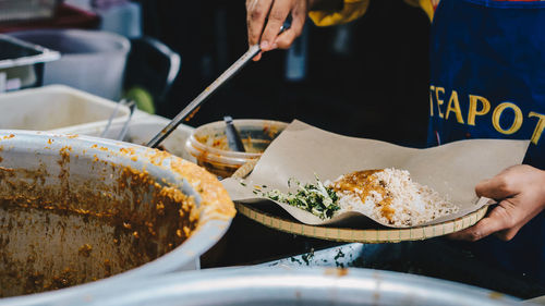 Close-up of hand holding food