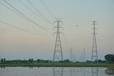 Electricity pylon on field