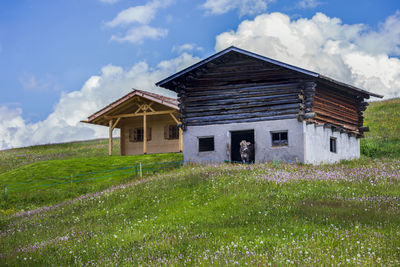 House on field against sky