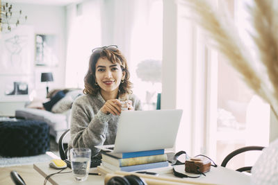 Portrait of woman working at home