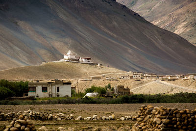 Houses and buildings against mountain