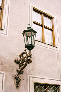 Low angle view of street light against building