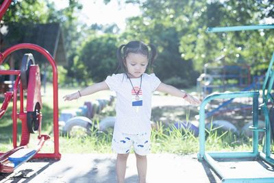 Portrait of boy standing in park