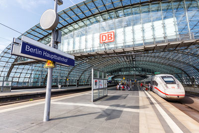 Information sign at railroad station in city