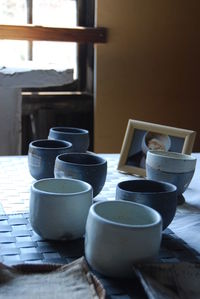 Cups on table at home