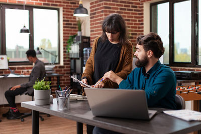 Business colleagues brainstorming in office