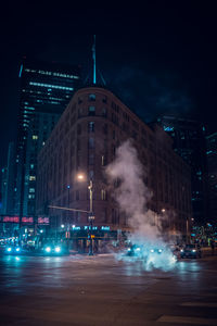 Illuminated city buildings at night