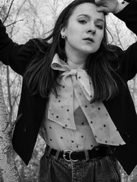 Portrait of young woman standing outdoors