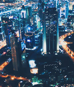 High angle view of illuminated buildings in city at night