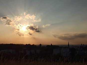 Scenic view of field against sky during sunset