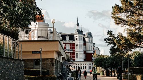 Buildings in town against sky