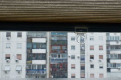 Reflection of buildings on glass window