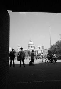 Tourists outside st paul cathedral against sky