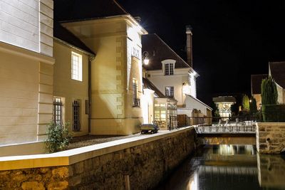 Buildings in city at night