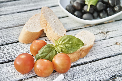 Close-up of fruits and leaves on table