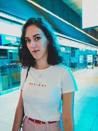 Portrait of beautiful young woman standing outdoors