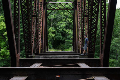 Man standing on built structure