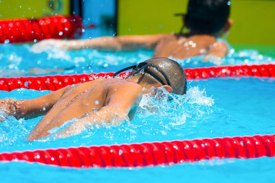 Boy swimming in pool